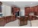 Kitchen featuring a wine rack, built-in appliances, and custom cabinetry that offers ample storage at 165 Futrell Lndg, New London, NC 28127
