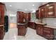 Full view of the kitchen with island cooktop, stylish cabinetry, and plenty of counter space at 165 Futrell Lndg, New London, NC 28127
