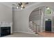 Inviting living room features a fireplace, staircase, and front door access at 165 Futrell Lndg, New London, NC 28127