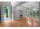 Sun-filled living room boasts hardwood floors, fireplace, and access to outdoor space at 165 Futrell Lndg, New London, NC 28127