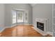 Cozy sitting room features a bay window and fireplace with marble surround at 165 Futrell Lndg, New London, NC 28127