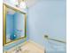 Fresh bathroom with large mirror, modern faucet, and a blue painted wall at 1670 Robins Nest Ct # D, Gastonia, NC 28054