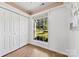 Bright bedroom features wood-look floors, closet, large window overlooking the landscaped yard at 1670 Robins Nest Ct # D, Gastonia, NC 28054