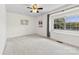 Bright bedroom featuring neutral walls, plush carpeting, and a window seat bathed in natural light at 1670 Robins Nest Ct # D, Gastonia, NC 28054