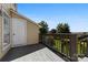 Wooden deck provides outdoor access with wood railing at 1670 Robins Nest Ct # D, Gastonia, NC 28054