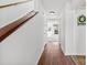 Bright foyer with wood floors, white walls, staircase, and decorative wall accents at 1670 Robins Nest Ct # D, Gastonia, NC 28054