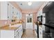Cozy kitchen features stainless appliances, white cabinetry, wood counters, and an eat-in area at 1670 Robins Nest Ct # D, Gastonia, NC 28054