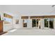 Open living area with fireplace, windows, glass doors, and access to the outdoor deck at 1670 Robins Nest Ct # D, Gastonia, NC 28054