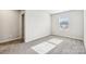 Bedroom with neutral carpet, white walls, and a window providing natural light at 2125 Rolling Hills Ct, Stanley, NC 28164