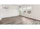 Bright bedroom with hardwood floors and several windows offering natural light and views at 2125 Rolling Hills Ct, Stanley, NC 28164