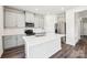 Modern kitchen with stainless steel appliances, a center island, and white cabinets at 2125 Rolling Hills Ct, Stanley, NC 28164