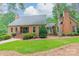 Beautiful brick home with well-maintained lawn and mature trees at 2332 Hemby Pl, Charlotte, NC 28270