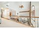 An upstairs view of a living room with vaulted ceilings, exposed beams, and a brick fireplace at 2332 Hemby Pl, Charlotte, NC 28270