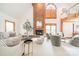 Bright and open living room with soaring ceilings and brick fireplace at 2332 Hemby Pl, Charlotte, NC 28270