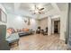 Open living room with a decorative ceiling, wood floors, and ample seating perfect for entertaining at 2332 Hemby Pl, Charlotte, NC 28270