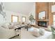 Cozy living room featuring a brick fireplace and a comfortable sectional sofa at 2332 Hemby Pl, Charlotte, NC 28270