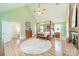 The main bedroom with wood floors offers ample space, natural light, and a neutral color palette at 2332 Hemby Pl, Charlotte, NC 28270