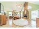A main bedroom suite features a brick fireplace, wood flooring, and a four-poster canopy bed at 2332 Hemby Pl, Charlotte, NC 28270