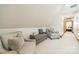 A sitting room features comfortable chairs, neutral colors, and plush carpeting at 2332 Hemby Pl, Charlotte, NC 28270