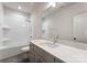 Clean bathroom features white subway tile, a gray vanity, and modern fixtures at 2600 Mason Cir # A, Charlotte, NC 28205