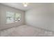 Bedroom with plush carpet, window views, and a bright, airy feel at 2600 Mason Cir # A, Charlotte, NC 28205