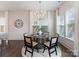 Cozy dining area with modern chandelier and large windows at 2600 Mason Cir # A, Charlotte, NC 28205