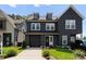 Modern two-story home featuring a front-entry garage and manicured lawn at 2600 Mason Cir # A, Charlotte, NC 28205
