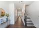 Bright hallway features hardwood floors, a staircase, and modern decor at 2600 Mason Cir # A, Charlotte, NC 28205