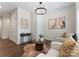 Inviting living room area with neutral furniture, side table, and chandelier lighting at 2600 Mason Cir # A, Charlotte, NC 28205