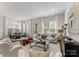 Open-concept living room with modern furnishings and lots of natural light at 2600 Mason Cir # A, Charlotte, NC 28205
