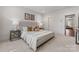 Spacious main bedroom with neutral decor, soft lighting, and view to other rooms at 2600 Mason Cir # A, Charlotte, NC 28205