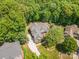 Aerial view of the house showcasing the roof, driveway, and surrounding trees at 2804 Pulaski Dr, Monroe, NC 28110