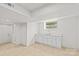 Finished basement with white cabinets, sink, and neutral flooring at 306 2Nd Avenue Ne Pl, Conover, NC 28613