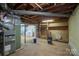 Unfinished basement with exposed utilities and concrete flooring at 306 2Nd Avenue Ne Pl, Conover, NC 28613
