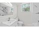 Modern bathroom featuring a white vanity, sleek fixtures, and a walk-in shower at 306 2Nd Avenue Ne Pl, Conover, NC 28613