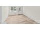 Bright room with hardwood flooring, a window, and a door to the backyard at 306 2Nd Avenue Ne Pl, Conover, NC 28613