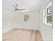 Comfortable bedroom with hardwood floors, ceiling fan, and bright windows at 306 2Nd Avenue Ne Pl, Conover, NC 28613