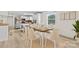 Cozy dining area featuring a wooden table and stylish chairs, adjacent to an open kitchen at 306 2Nd Avenue Ne Pl, Conover, NC 28613