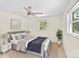 Serene main bedroom featuring a ceiling fan, neutral decor, and natural light at 306 2Nd Avenue Ne Pl, Conover, NC 28613