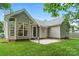 Exterior view of the home showcasing the well-manicured lawn and siding at 3114 Pine Pointe St, Matthews, NC 28104