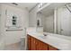 Bathroom features a wooden vanity, large mirror, and bath tub/shower combo at 3114 Pine Pointe St, Matthews, NC 28104