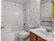 Bathroom with wood vanity and floral accents at 3114 Pine Pointe St, Matthews, NC 28104
