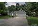 Charming single-story home featuring a well-maintained lawn, attached garage, and inviting curb appeal at 3114 Pine Pointe St, Matthews, NC 28104