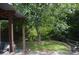 Backyard with patio and mature trees at 3136 Blueberry Dr, Monroe, NC 28110