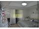Comfortable bedroom featuring a tray ceiling, modern bedding and plenty of natural light at 3136 Blueberry Dr, Monroe, NC 28110