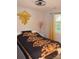 Comfortable bedroom with patterned bedding and a hexagon wall mirror at 3136 Blueberry Dr, Monroe, NC 28110