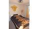 Comfortable bedroom with gold patterned bedding and a hexagon wall mirror at 3136 Blueberry Dr, Monroe, NC 28110