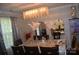 Elegantly decorated dining room featuring a stunning chandelier and ample seating at 3136 Blueberry Dr, Monroe, NC 28110