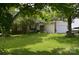Charming home featuring well-manicured lawn, mature trees, and a welcoming front entrance at 3136 Blueberry Dr, Monroe, NC 28110