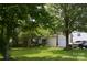 Charming home featuring well-manicured lawn, mature trees, and a welcoming front entrance at 3136 Blueberry Dr, Monroe, NC 28110
